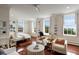 Spacious bedroom featuring a desk, sitting area, and hardwood floors at 55 E Bay St, Charleston, SC 29401