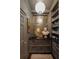 Butler's pantry featuring a mirror, prep sink and gray cabinets at 55 E Bay St, Charleston, SC 29401