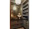 Butler's pantry featuring a mirror, prep sink and gray cabinets at 55 E Bay St, Charleston, SC 29401
