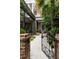 Charming courtyard with brick and iron features, lush landscaping and seating areas at 55 E Bay St, Charleston, SC 29401