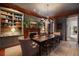 Elegant dining room with a fireplace, built-in shelving, and a large dining table at 55 E Bay St, Charleston, SC 29401