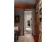 Dining room featuring a painting, built-in bookshelves and doors leading to the hall at 55 E Bay St, Charleston, SC 29401