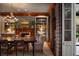 Elegant dining room featuring a fireplace, wood trim, chandelier and access to the porch at 55 E Bay St, Charleston, SC 29401