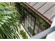 Exterior view showcases a modern sunroom design and greenery around the property's exterior at 55 E Bay St, Charleston, SC 29401