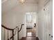 Upstairs hallway leading to a bedroom, offering hardwood floors and natural light at 55 E Bay St, Charleston, SC 29401