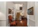 Hallway leading to a staircase, detailed trim, and views into other rooms at 55 E Bay St, Charleston, SC 29401