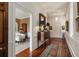 Elegant hallway featuring hardwood floors, decorative molding, a chandelier, and views into adjacent rooms at 55 E Bay St, Charleston, SC 29401