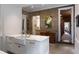 Bright kitchen features an island, stainless steel appliances, and access to other rooms of the house at 55 E Bay St, Charleston, SC 29401