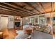 Inviting living room showcasing reclaimed wood ceilings and fireplace with decorative touches at 55 E Bay St, Charleston, SC 29401