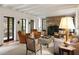 Elegant living room featuring exposed brick fireplace and multiple windows at 55 E Bay St, Charleston, SC 29401