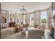 Bright living room with large windows, neutral decor, and stylish furnishings creates an inviting space at 55 E Bay St, Charleston, SC 29401