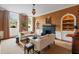 Living room with fireplace, built-in bookcases, and inviting seating arrangement at 55 E Bay St, Charleston, SC 29401