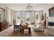 Well-lit living room featuring comfortable seating, elegant decor, and large windows with scenic views at 55 E Bay St, Charleston, SC 29401