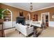 Cozy living room showcasing a fireplace, built-in shelving, and comfortable seating at 55 E Bay St, Charleston, SC 29401