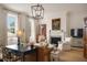 Cozy living room featuring a fireplace, comfortable seating, and ample natural light at 55 E Bay St, Charleston, SC 29401