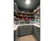 Walk-in pantry with custom shelving, and stone countertops offers plenty of storage for appliances and cookware at 55 E Bay St, Charleston, SC 29401