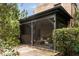 Inviting screened porch featuring comfortable seating and a brick exterior at 55 E Bay St, Charleston, SC 29401