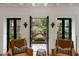 Elegant sitting room showcases a garden water feature visible through windows at 55 E Bay St, Charleston, SC 29401