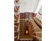 Multi-level staircase showcasing wood, carpet, and overhead lighting at 55 E Bay St, Charleston, SC 29401