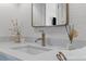 Contemporary bathroom vanity featuring stylish faucet and neutral countertop at 553 Old Compass Rd, Daniel Island, SC 29492