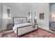 Comfortable bedroom with an area rug and two bedside tables with lamps at 553 Old Compass Rd, Daniel Island, SC 29492