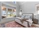 Bedroom with a large window seat overlooking the waterway with lots of natural light at 553 Old Compass Rd, Daniel Island, SC 29492