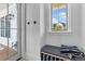 Inviting entryway with a bench, storage, and natural light streaming through the window at 553 Old Compass Rd, Daniel Island, SC 29492