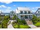 Charming home showcasing lush landscaping, inviting entryway, and a metal roof, providing curb appeal at 553 Old Compass Rd, Daniel Island, SC 29492