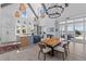 Inviting kitchen with island seating, modern appliances, and a nearby dining area overlooking waterfront views at 553 Old Compass Rd, Daniel Island, SC 29492