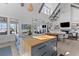 Open concept kitchen with large island, modern finishes, and seamless flow to the living area at 553 Old Compass Rd, Daniel Island, SC 29492