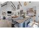 Modern kitchen featuring a large island with seating, stainless steel appliances, and open to living area at 553 Old Compass Rd, Daniel Island, SC 29492