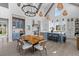 Elegant kitchen featuring a large island with seating, custom cabinetry, and modern lighting fixtures at 553 Old Compass Rd, Daniel Island, SC 29492