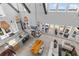 Open-concept living area with high ceilings and abundant natural light from large windows at 553 Old Compass Rd, Daniel Island, SC 29492