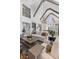 Open floorplan living room with vaulted ceilings, wood beams, and an open concept design at 553 Old Compass Rd, Daniel Island, SC 29492