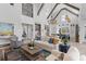 Spacious living room with vaulted ceilings, wood beams, and an open concept design with kitchen at 553 Old Compass Rd, Daniel Island, SC 29492