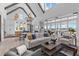 Bright living room with vaulted ceilings, wood beams, and open floor plan with kitchen access at 553 Old Compass Rd, Daniel Island, SC 29492