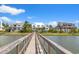 Picturesque view from a pier looking back at a row of beautiful waterfront homes at 553 Old Compass Rd, Daniel Island, SC 29492