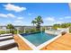 Stunning pool and spa with beautiful water views, deck chairs, and sunny skies at 553 Old Compass Rd, Daniel Island, SC 29492