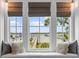 Window seat with plush pillows overlooking the waterway at 553 Old Compass Rd, Daniel Island, SC 29492