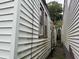 An awkward outdoor space between two houses with peeling paint and a rusted drainpipe at 6 Orrs Ct, Charleston, SC 29403