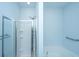 Bright bathroom with glass-enclosed shower, soaking tub, and chrome fixtures at 765 Certificate Ct, Charleston, SC 29414