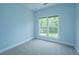 Empty bedroom with carpet, base molding and double window providing plenty of natural light at 765 Certificate Ct, Charleston, SC 29414
