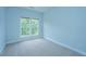 Bedroom with a large window providing ample natural light and light blue walls at 765 Certificate Ct, Charleston, SC 29414