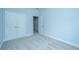 Bedroom with carpet, closet, base molding, and an entry door partially open at 765 Certificate Ct, Charleston, SC 29414