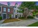 Exterior of townhouses with brick facade and manicured lawns, set against a vibrant evening sky at 765 Certificate Ct, Charleston, SC 29414