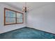 Dining room with chandelier, wood trim window, carpet, and white walls at 7659 Allwood Ave, North Charleston, SC 29418