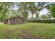 Large backyard featuring a brick home, grassy lawn and mature trees, great for outdoor activities at 10 Teaneck Rd, Goose Creek, SC 29445