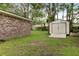 Backyard features a storage building, brick house and mature trees at 10 Teaneck Rd, Goose Creek, SC 29445