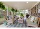 Relaxing covered outdoor patio featuring comfortable seating and a stylish rug at 10 Teaneck Rd, Goose Creek, SC 29445