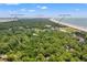 Aerial view of 1025 Scaup Ct near Cougar Point Golf Course and Clubhouse, showcasing a serene and lush setting at 1025 Scaup Ct, Kiawah Island, SC 29455